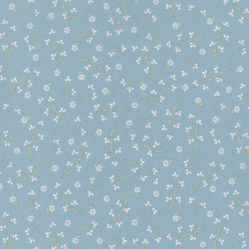 faded blue fabric featuring a ditsy pattern of long stemmed white flowers