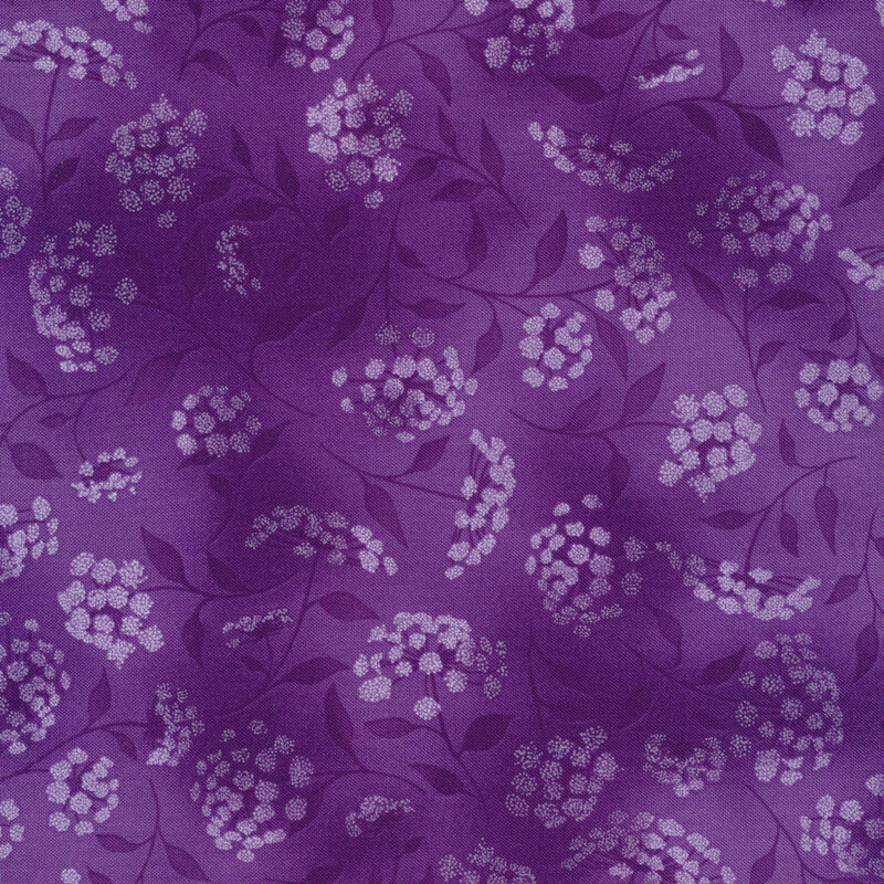 mottled purple fabric featuring leaves, vines and florals 