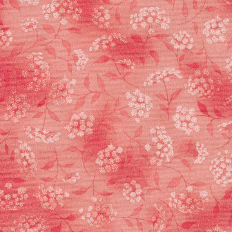 mottled pink fabric featuring leaves, vines and florals 