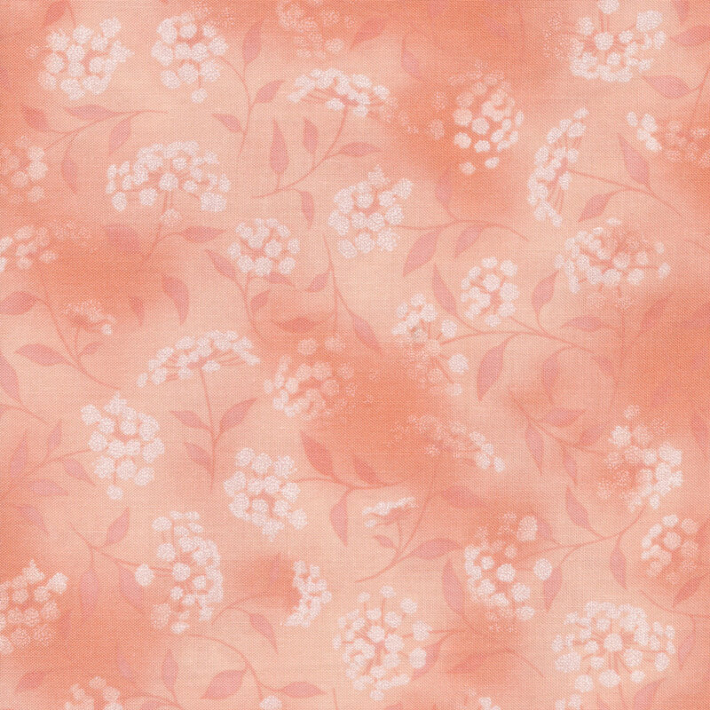 mottled peach fabric featuring leaves, vines and florals 