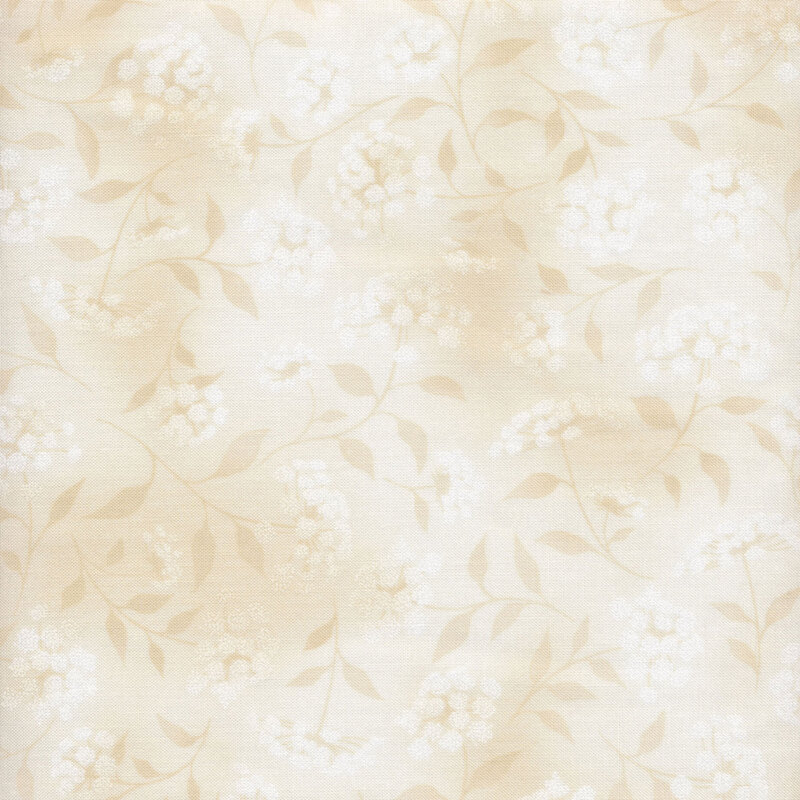 mottled light tan fabric featuring leaves, vines and florals 