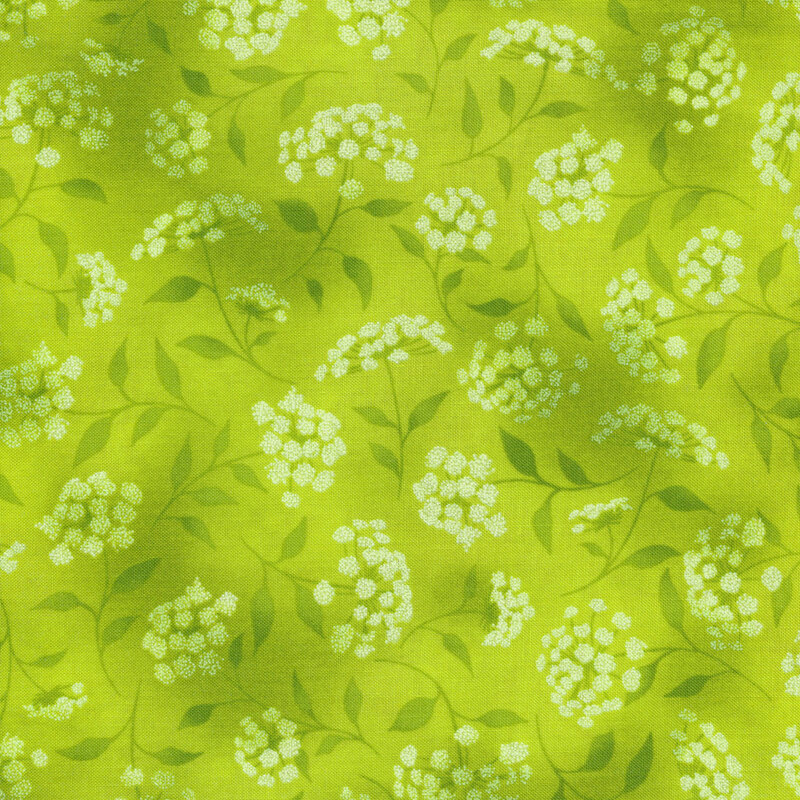 mottled neon green fabric featuring leaves, vines and florals 