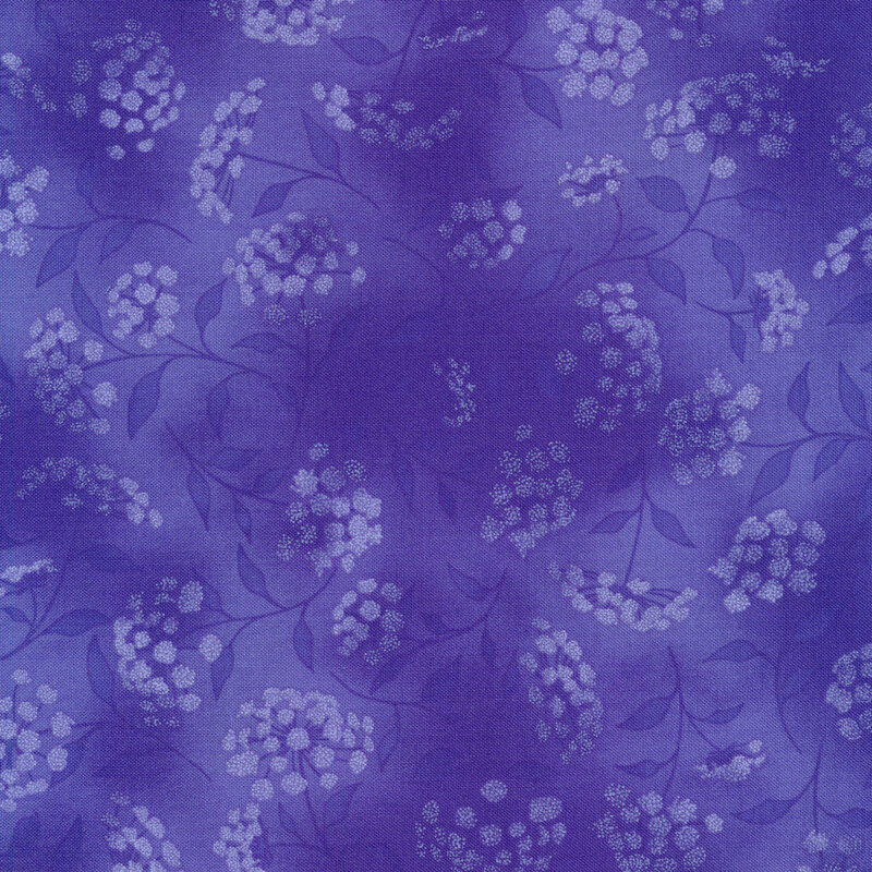 mottled purple/blue fabric featuring leaves, vines and florals 
