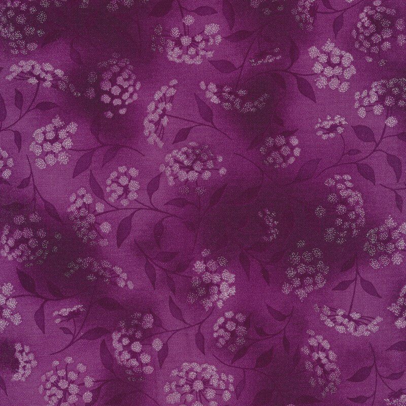 mottled magenta fabric featuring leaves, vines and florals 