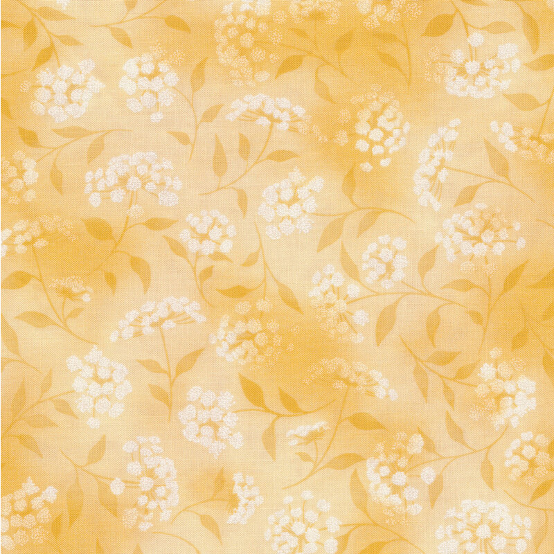 mottled yellow fabric featuring leaves, vines and florals 