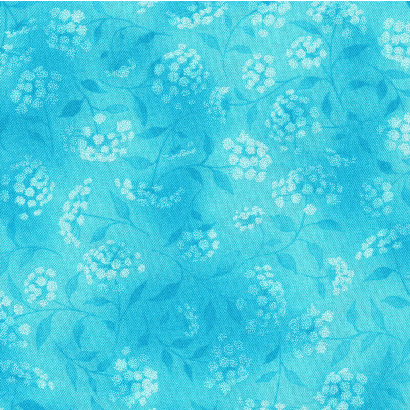 mottled sky blue fabric featuring leaves, vines and florals 