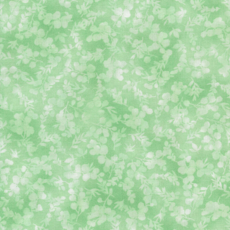 mottled, tonal mint green fabric featuring leaves and vines