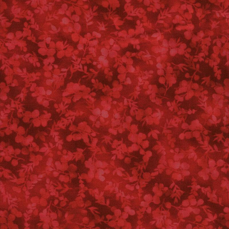 mottled, tonal red fabric featuring leaves and vines