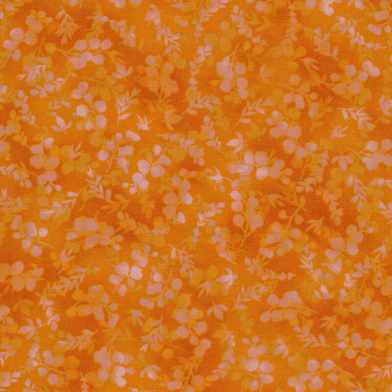 mottled, tonal orange fabric featuring leaves and vines