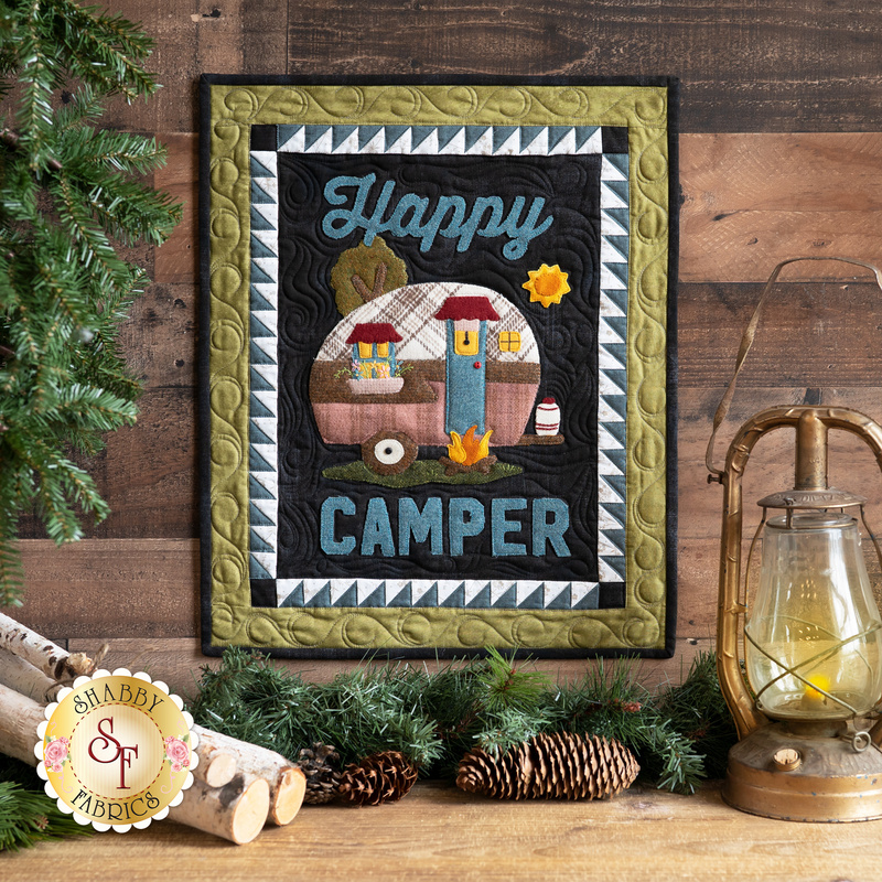 Wall hanging with appliqué camper and the phrase: 