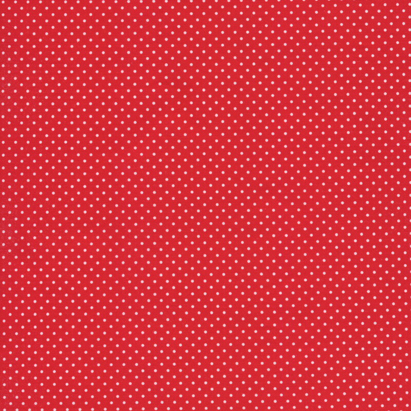 red fabric with tiny white polka dots