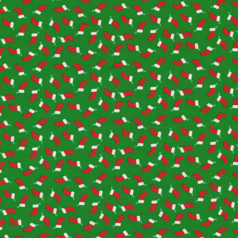 Green fabric with red Christmas stockings all over