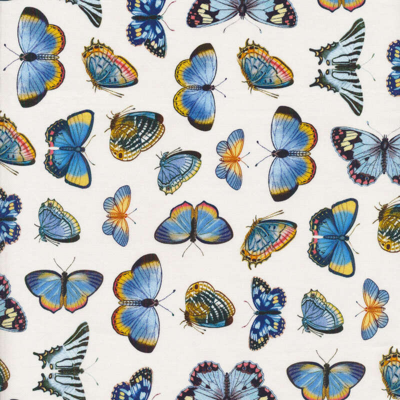 Cream colored fabric covered in small blue butterflies
