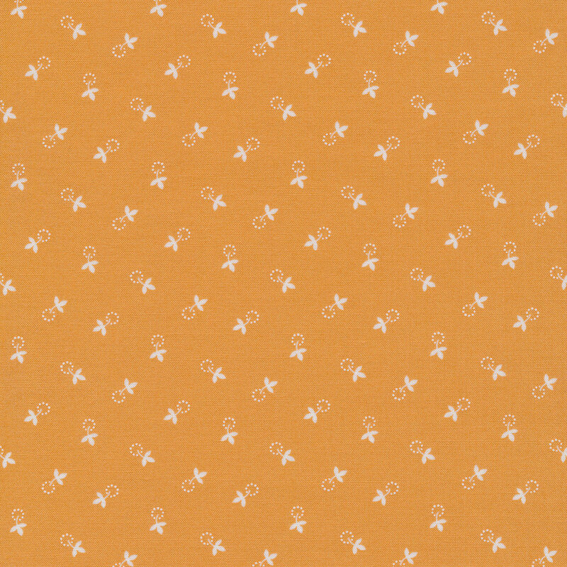soft orange fabric with small, cream colored leaves