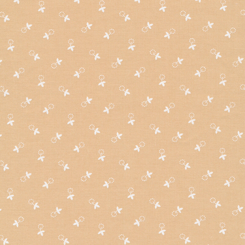 tan fabric with cream colored, small leaves