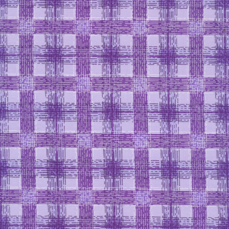 Lavender fabric with tiny purple lines interlacing together in a plaid or gingham pattern