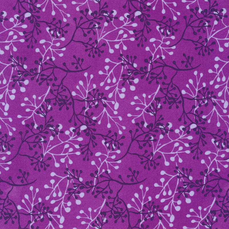 purple fabric with branches in varying shades of purple layered atop one another
