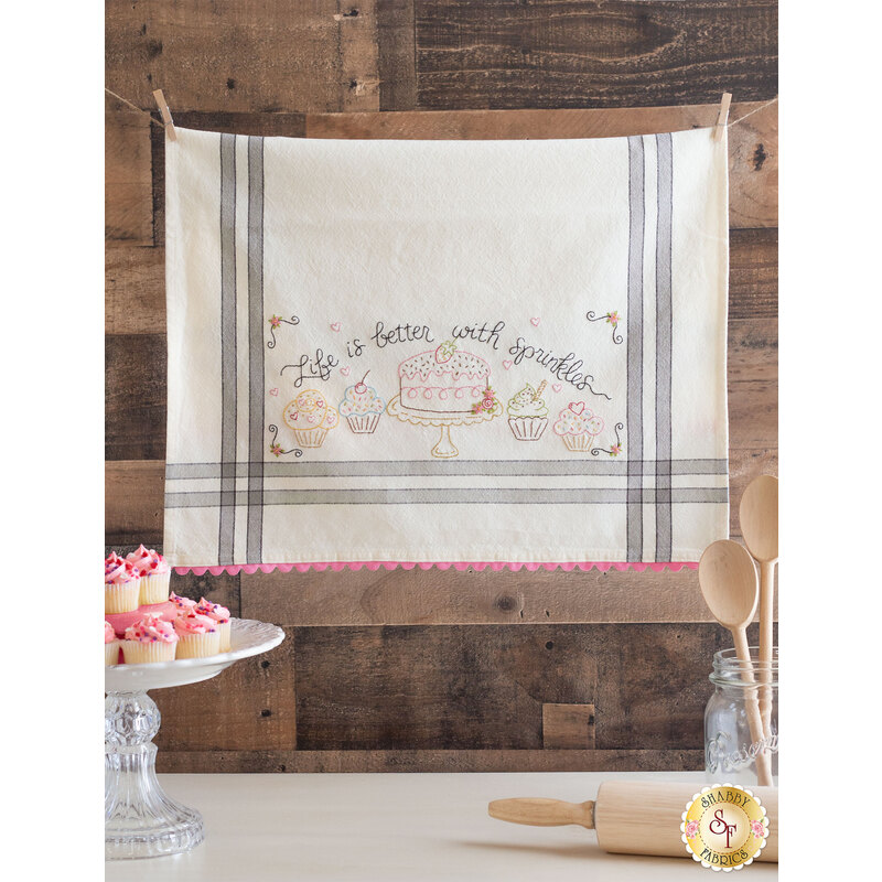 Image of a Bareroots Embroidery Towel in Sprinkles on a rustic background.