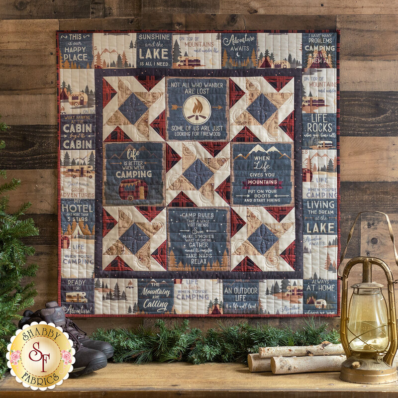 9 block wall hanging quilt filled with camping motifs and phrases.