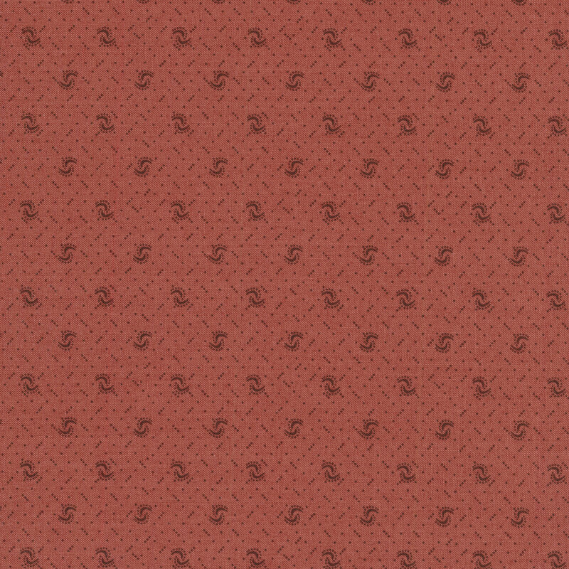 Fabric of a pin dot and curved illustrative print on a rose colored background.