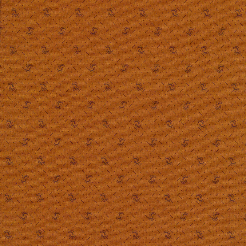 Fabric of a pin dot and curved illustrative print on a dark orange background.