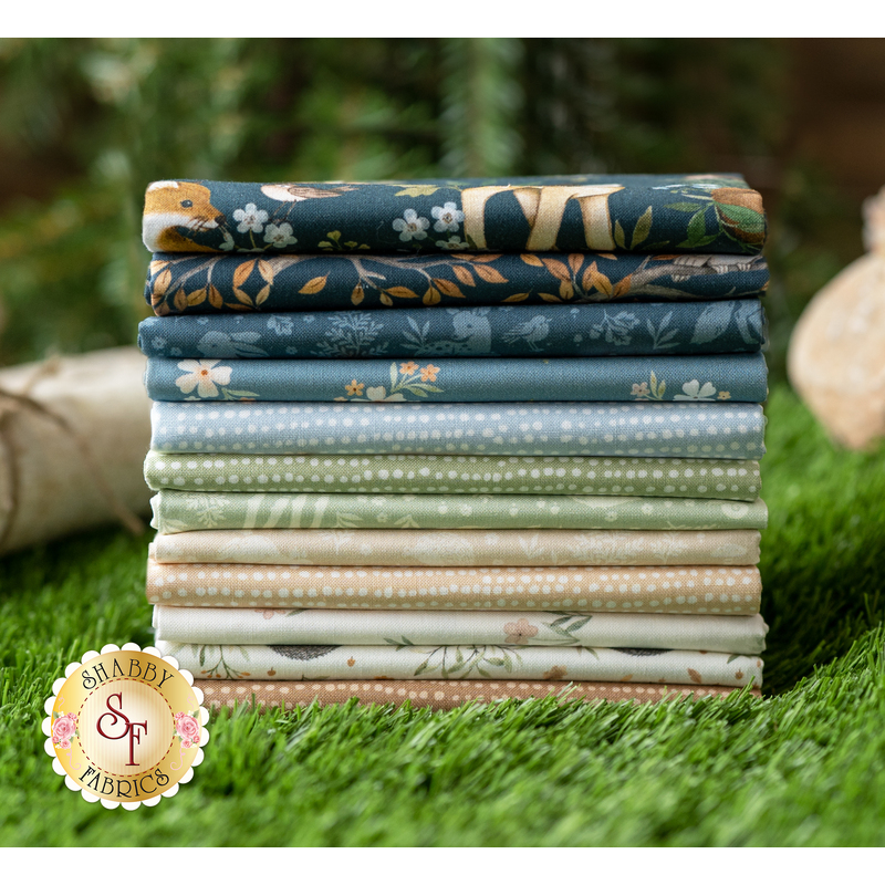 A stack of fabrics included in the Little Forest FQ Set