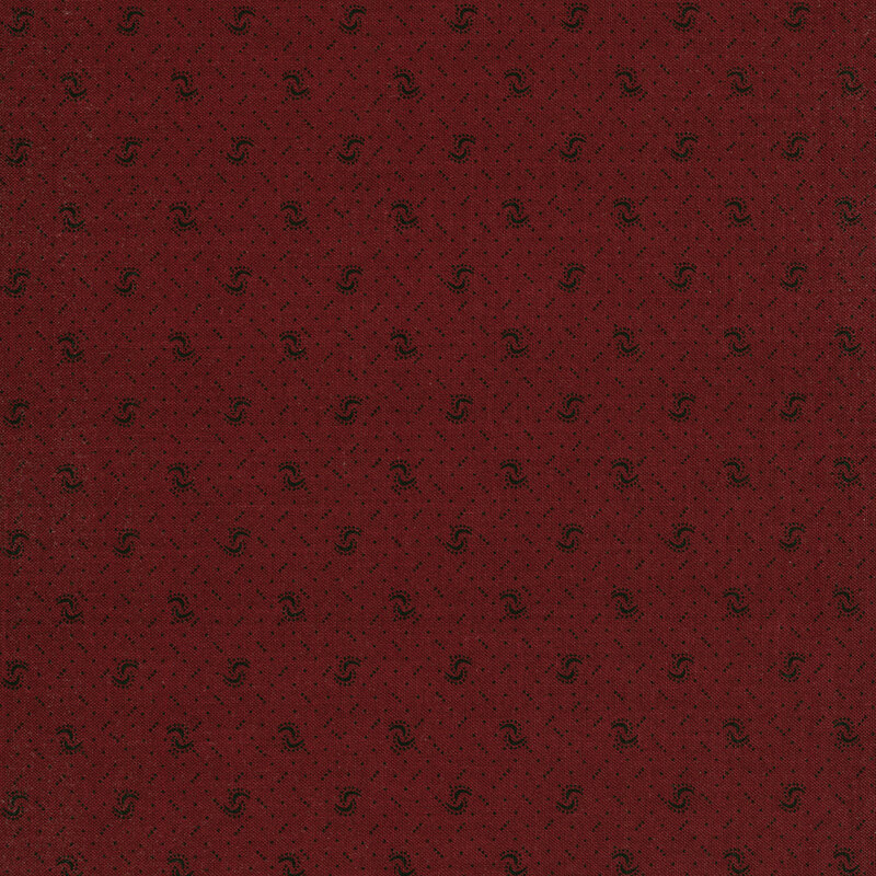 Fabric of a pin dot and curved illustrative print on a burgundy background.