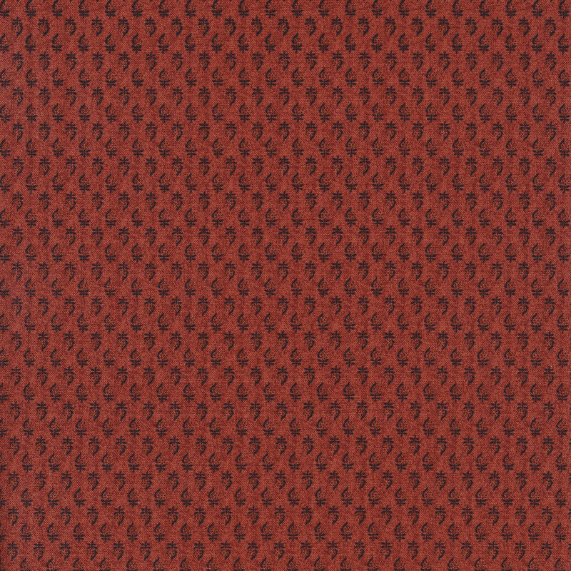 light red fabric featuring tiny embellishments uniformly spaced apart