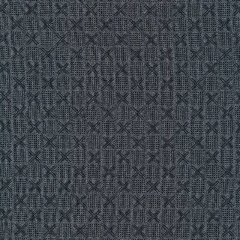 Grey-blue fabric with dark tonal x's and squares made up of dots