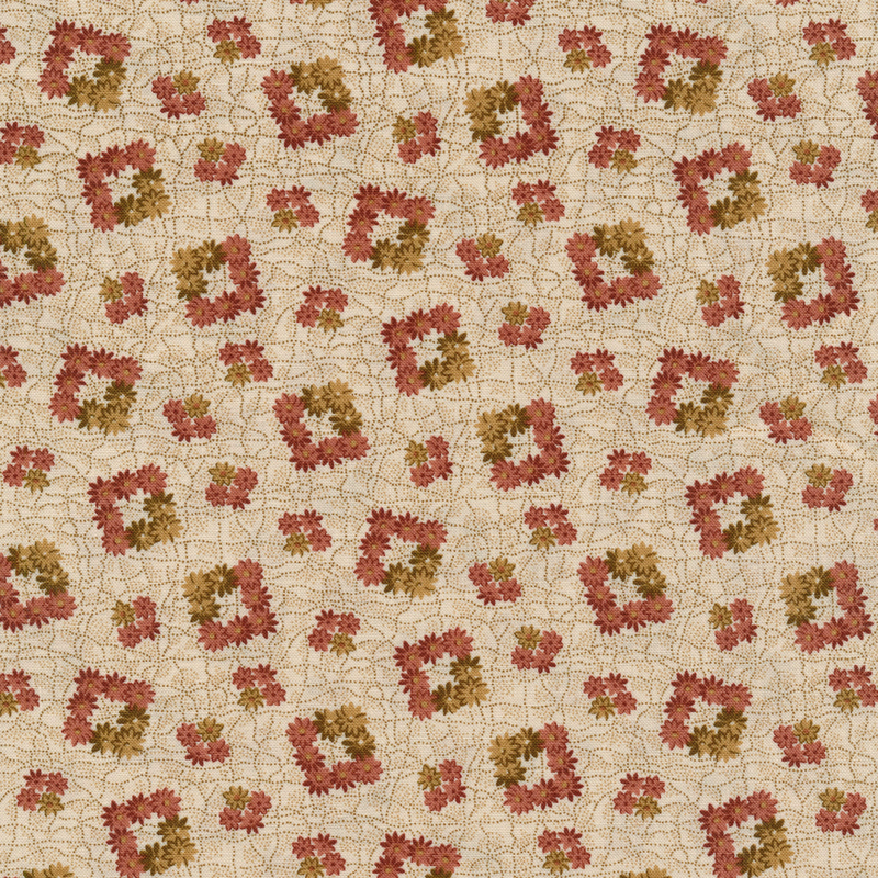 cream colored fabric with square shaped flower wreaths made up of brown and pink flowers on a cracked textured background