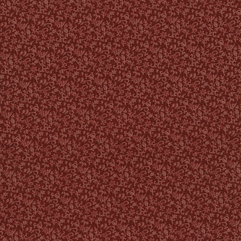 Abstract designs on dark salmon colored fabric with dark dot accents