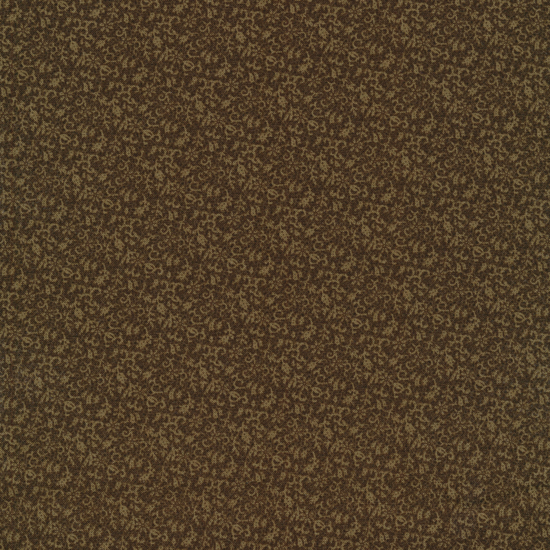 Abstract pale designs on dark brown colored fabric with dark dot accents
