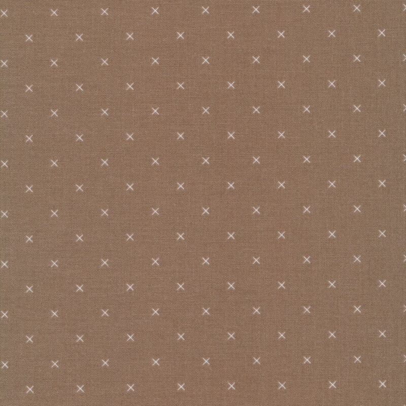 Small cream x's on a brown background
