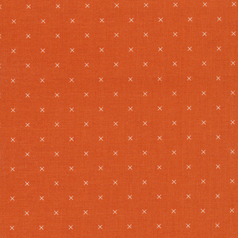 Small cream x's on an orange background