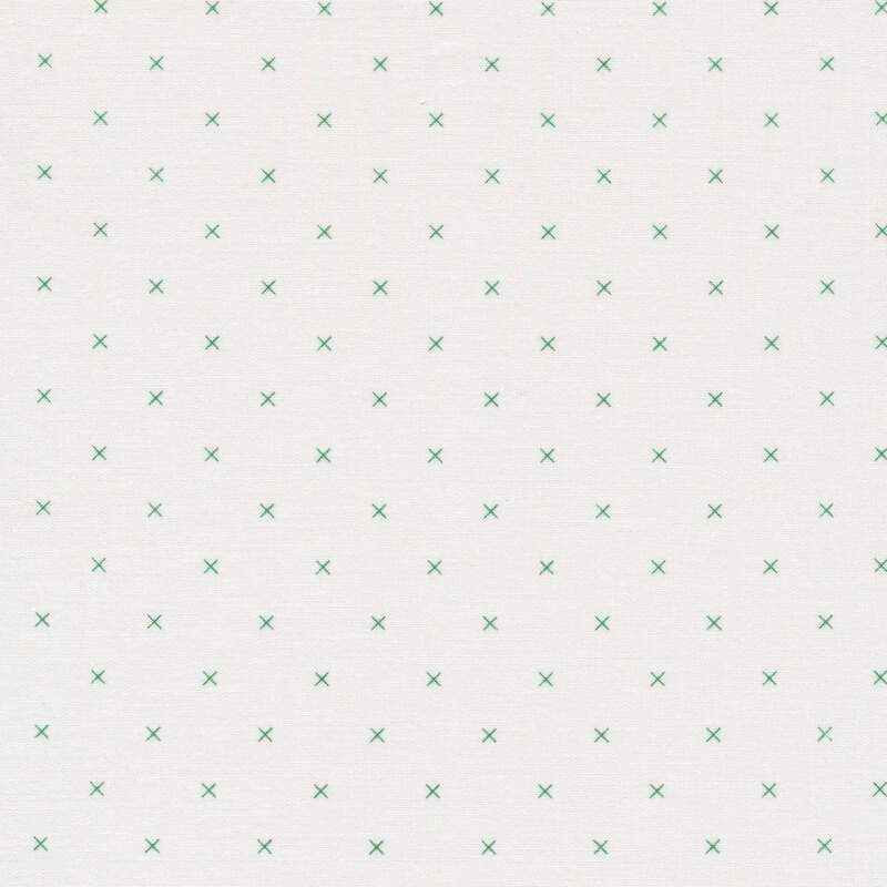 Small green x's on a cream background