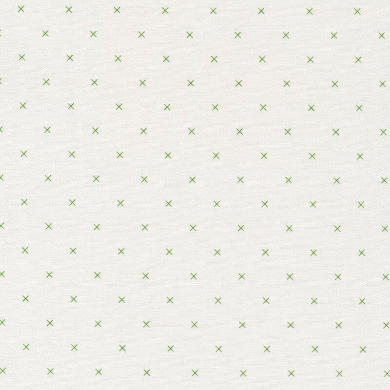 Small green x's on a cream background