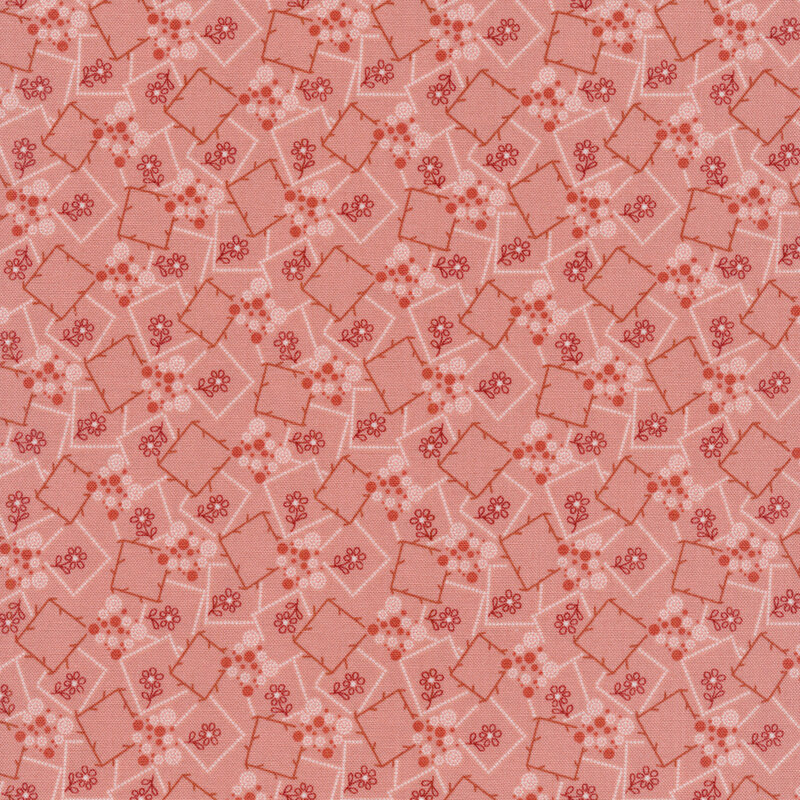 Pink fabric with red and white outlined squares with small flower embellishments