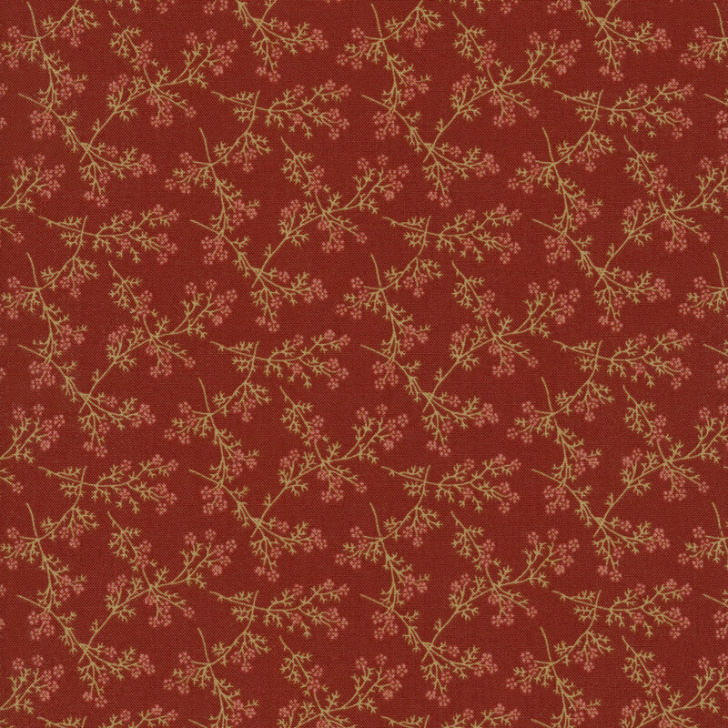 red fabric with light colored branches full of flowers