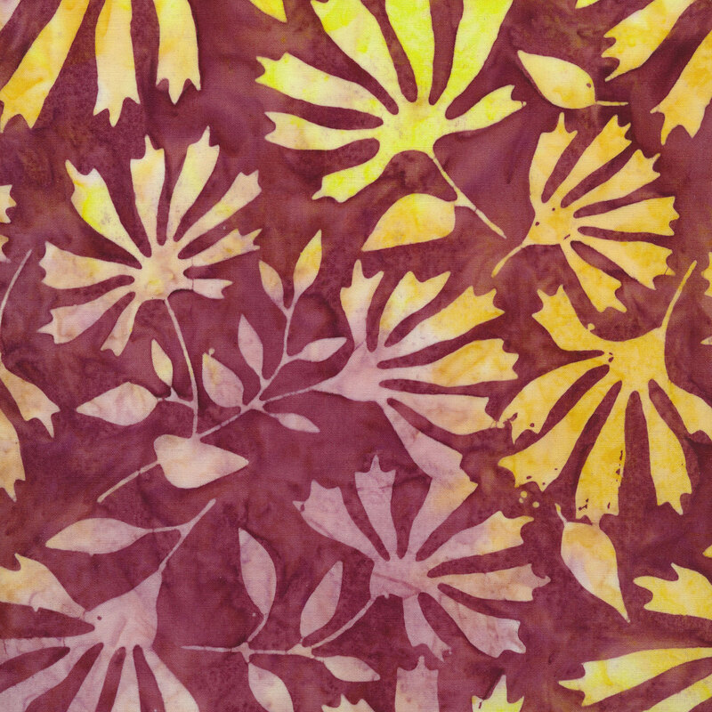 Purple batik fabric with mottled yellow and pale purple silhouettes of flowers