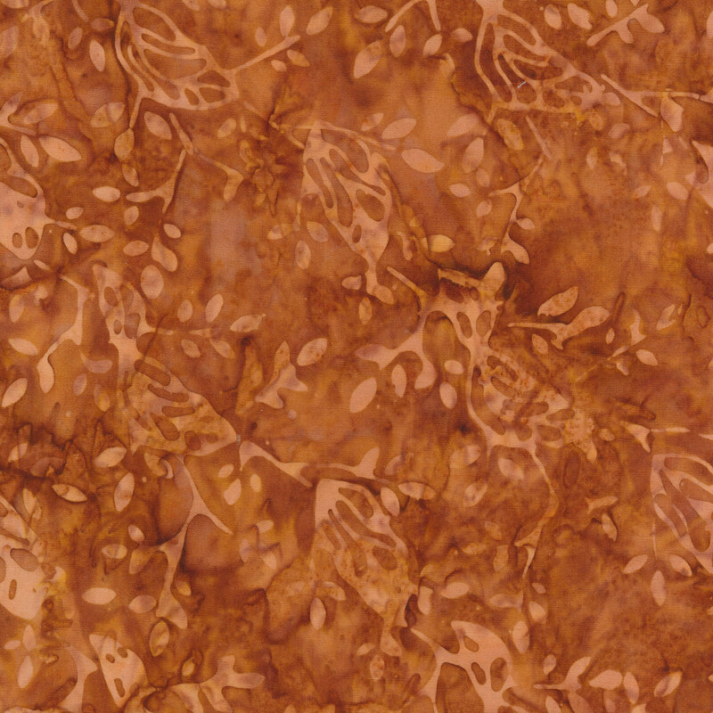 Brown tonal batik fabric with light tan leaves and vines all over