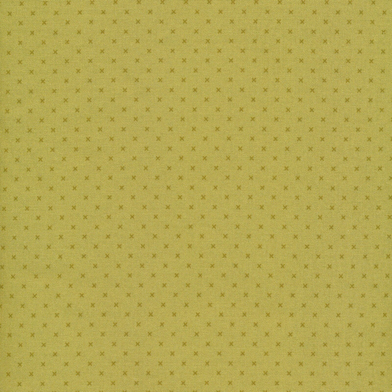 Tonal green sewing fabric with small dark green x's all over a green background