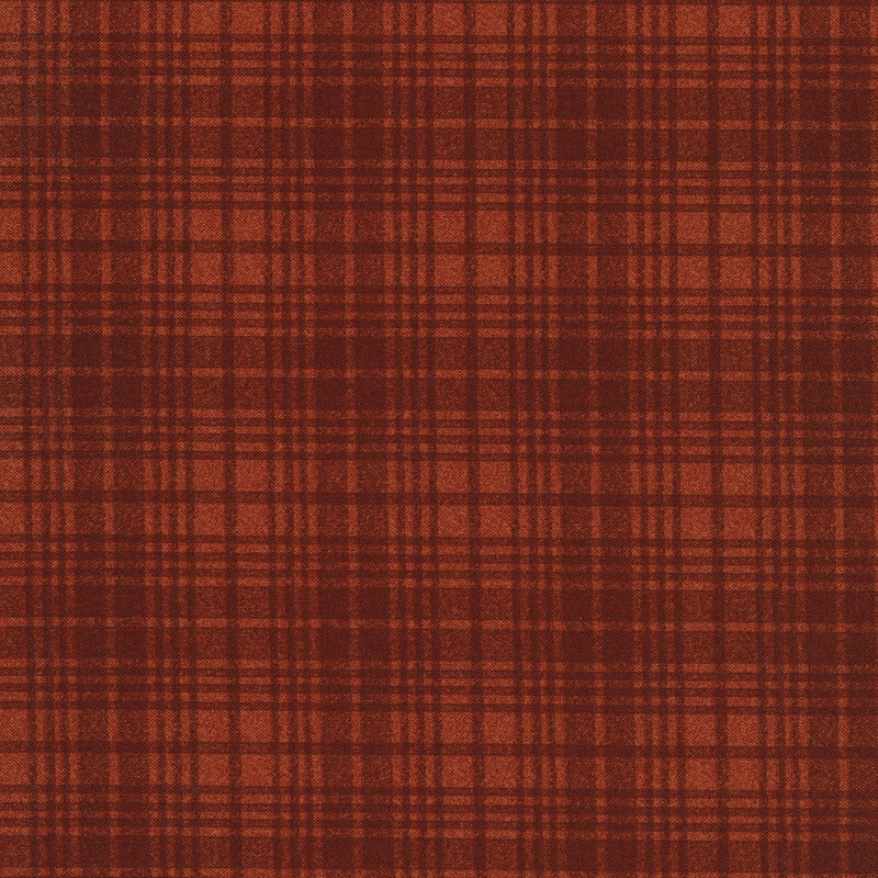 A burnt orange tonal plaid fabric