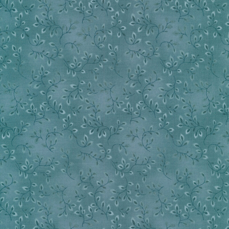 A dusty teal tonal fabric with vines and mottling
