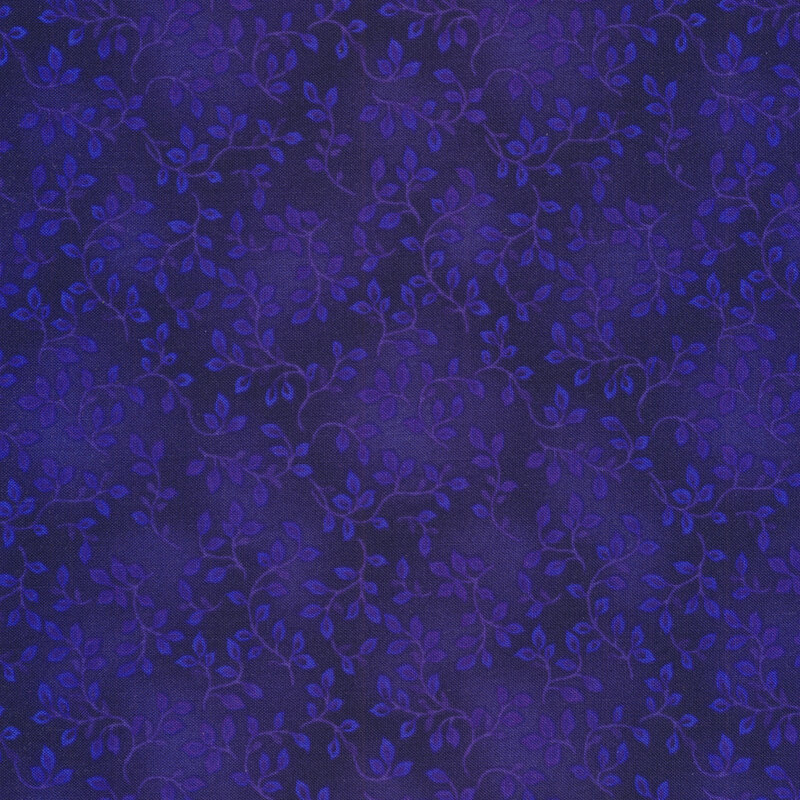A royal blue tonal fabric with vines and mottling