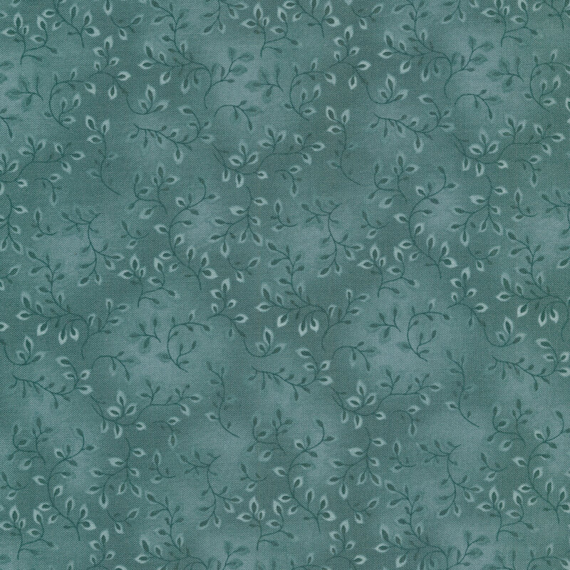 A tonal light teal fabric with vines and mottling