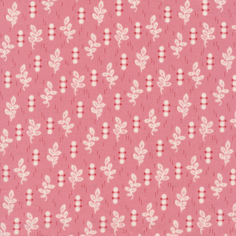 Light pink fabric with small white dots and leaf sprigs all over