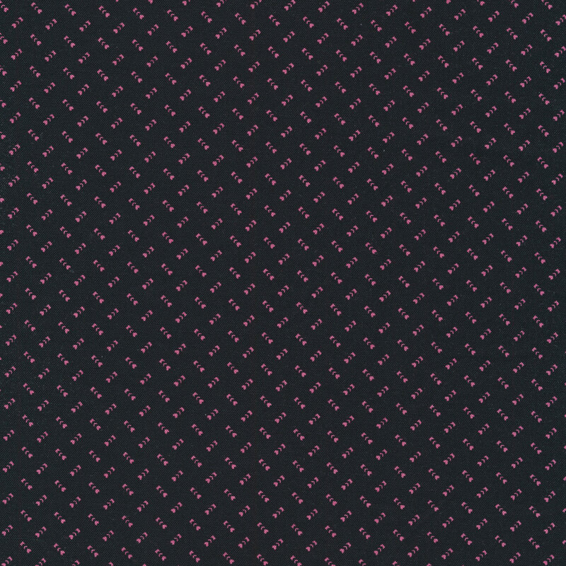 Black fabric with small pink alternating hearts and leaf sprigs all over