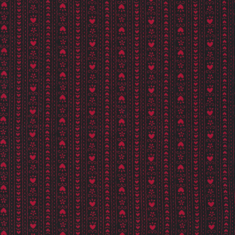 Black fabric with red hearts and stripes all over