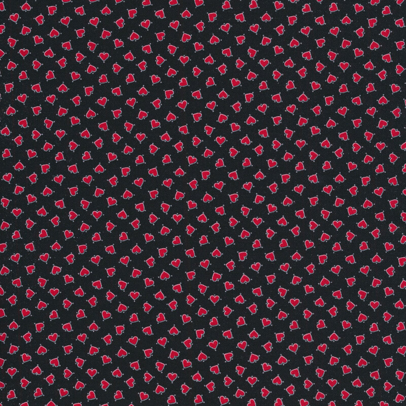 Black fabric with small red tossed ditsy hearts all over