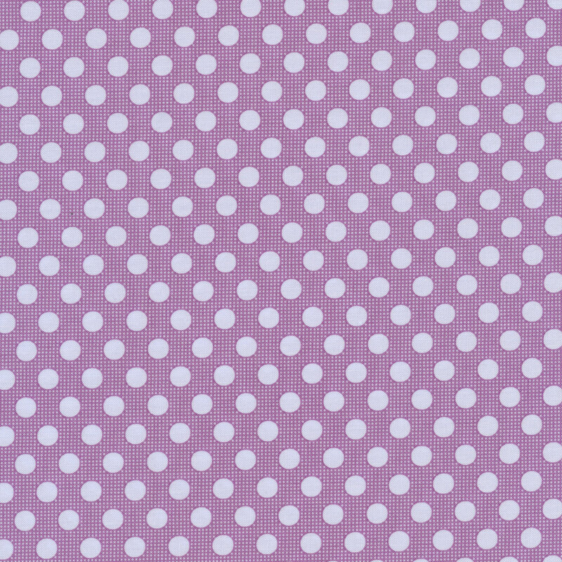 Dark purple fabric with pale purple polka dots all over